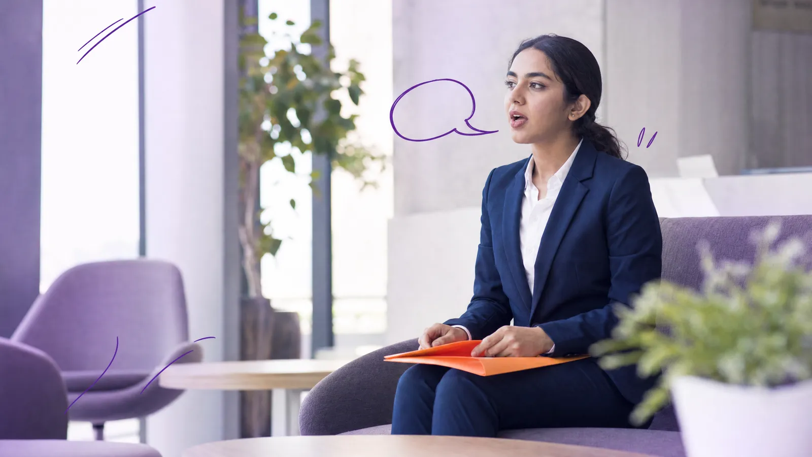 A young woman in a navy suit waits in an office lobby with an orange folder on her lap, quietly rehearsing her answers, a small speech bubble doodled beside her
